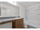 Bathroom featuring a granite vanity, integrated sink, and a shower-tub combination at 219 Ash Way, Auburndale, FL 33823