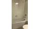 Clean bathroom with a shower and tub at 4747 Tribute Trl, Kissimmee, FL 34746