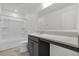 A bathroom featuring shower-tub combo, modern vanity, and large mirror provides functionality at 528 Carya Way, Auburndale, FL 33823