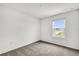 Bedroom features neutral carpet, a window with backyard views, and ample natural light at 528 Carya Way, Auburndale, FL 33823
