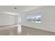 Bright living room with tile floors, large windows, and sliding doors at 528 Carya Way, Auburndale, FL 33823