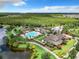 Aerial view of community with pool and lake at 8622 Dufferin Ln, Orlando, FL 32832