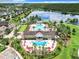 Community pool and clubhouse with lake view at 8622 Dufferin Ln, Orlando, FL 32832
