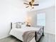 Cozy bedroom with metal framed bed and ceiling fan at 8622 Dufferin Ln, Orlando, FL 32832