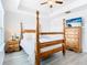 Bedroom with wood post bed, dresser, and nightstand at 8622 Dufferin Ln, Orlando, FL 32832