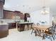 Modern kitchen with dark wood cabinets, granite countertops, and a breakfast table at 8622 Dufferin Ln, Orlando, FL 32832