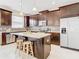 Modern kitchen with dark wood cabinets, granite countertops and island at 8622 Dufferin Ln, Orlando, FL 32832