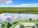 Serene lake with walking path and lush greenery at 8622 Dufferin Ln, Orlando, FL 32832