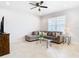 Spacious living room with sectional sofa, coffee table, and ample natural light at 8622 Dufferin Ln, Orlando, FL 32832
