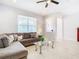 Cozy living room featuring a comfortable sectional sofa and a coffee table at 8622 Dufferin Ln, Orlando, FL 32832