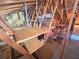 Unfinished attic space with plywood shelving for storage at 956 Bucksaw Pl, Longwood, FL 32750