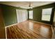 Bedroom with wood floors and two windows at 956 Bucksaw Pl, Longwood, FL 32750