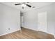 Bright bedroom features hardwood floors, ceiling fan, and neutral paint, offering a serene and inviting space at 3725 Conroy Rd # 2131, Orlando, FL 32839