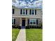 Charming two-story home with blue shutters and a well-manicured lawn at 6098 Galloping Dr, Apopka, FL 32712