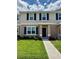 Charming two-story home boasts a well-manicured lawn, a blue door, and elegant blue shutters at 6106 Galloping Dr, Apopka, FL 32712
