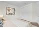 A bedroom features a neutral color palette, soft carpet, closet, and a simple design at 13007 Bromborough Dr, Orlando, FL 32832