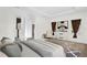 Serene bedroom with a neutral color palette, tray ceilings, and natural light creates a relaxing retreat at 13007 Bromborough Dr, Orlando, FL 32832