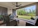 Relaxing covered patio with comfortable seating and serene backyard views, creating a perfect outdoor retreat at 13007 Bromborough Dr, Orlando, FL 32832