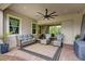 Beautifully shaded outdoor patio with stylish furniture, offering a comfortable space for relaxation and entertaining at 13007 Bromborough Dr, Orlando, FL 32832