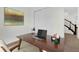 Another angle of the home office featuring a work space and view into the stairway at 13007 Bromborough Dr, Orlando, FL 32832