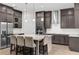Modern kitchen with a center island, stainless steel appliances, and ample cabinet space at 13007 Bromborough Dr, Orlando, FL 32832