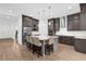 Modern kitchen with a center island, stainless steel appliances, and ample cabinet space at 13007 Bromborough Dr, Orlando, FL 32832