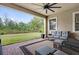 Paver patio with outdoor seating overlooking green lawn at 13007 Bromborough Dr, Orlando, FL 32832
