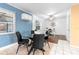 Dining area with glass table and chairs connects to an office space at 229 Sherry Ave, Winter Springs, FL 32708