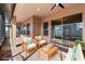 Relaxing covered patio with comfortable seating and ample space for outdoor enjoyment at 2731 Flintlock Ave, Clermont, FL 34711