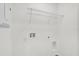 This laundry area is ready for appliances, complete with a storage shelf, and utility connections at 367 Sequoia Dr, Lake Wales, FL 33859