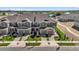 New townhome community featuring manicured lawns, paved driveways, and attached garages at 375 Sequoia Dr, Lake Wales, FL 33859