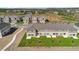 Exterior view of townhomes with backyard patios and green space at 375 Sequoia Dr, Lake Wales, FL 33859