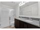 Modern bathroom featuring dual sinks, granite countertops, and a glass-enclosed shower at 375 Sequoia Dr, Lake Wales, FL 33859