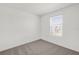 Bright bedroom with plush carpet and a window with lots of natural light at 375 Sequoia Dr, Lake Wales, FL 33859