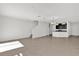 Bright living room with tile floors flows into modern kitchen, perfect for entertaining at 375 Sequoia Dr, Lake Wales, FL 33859