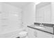 Bright bathroom featuring a shower-tub combo and vanity with a granite countertop at 410 Sequoia Dr, Lake Wales, FL 33859