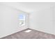 Carpeted bedroom showcasing a window allowing for natural light at 410 Sequoia Dr, Lake Wales, FL 33859
