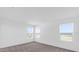 Bright, modern bedroom featuring neutral carpet and two windows providing plenty of natural light at 410 Sequoia Dr, Lake Wales, FL 33859