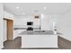 Open kitchen featuring white cabinetry, granite counters and stainless appliances at 410 Sequoia Dr, Lake Wales, FL 33859