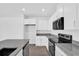 Bright kitchen featuring white cabinets and stainless steel appliances at 410 Sequoia Dr, Lake Wales, FL 33859