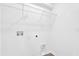 Laundry room featuring a wire shelf with white walls at 410 Sequoia Dr, Lake Wales, FL 33859