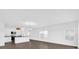 Open concept living room featuring hardwood floors, modern lighting and oversized windows at 410 Sequoia Dr, Lake Wales, FL 33859