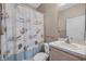 Bathroom featuring a vanity with a white sink and a seashell-themed shower curtain at 4112 Aberdeen Ln, Lake Wales, FL 33859