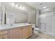 Bright bathroom with double sink vanity, shower, and toilet at 4112 Aberdeen Ln, Lake Wales, FL 33859