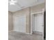 Neutral-colored bedroom with a walk-in closet and view to the hallway at 4112 Aberdeen Ln, Lake Wales, FL 33859