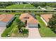 Charming single-story home boasts lush landscaping, brick driveway, and solar panels for energy efficiency at 4112 Aberdeen Ln, Lake Wales, FL 33859