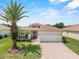 Charming single-story home featuring a well-maintained lawn and a spacious two-car garage at 4112 Aberdeen Ln, Lake Wales, FL 33859