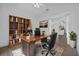 Well-appointed home office featuring a bookshelf and view to an eat-in kitchen at 4112 Aberdeen Ln, Lake Wales, FL 33859