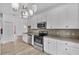Clean kitchen with white cabinetry, stone backsplash and stainless steel oven at 4112 Aberdeen Ln, Lake Wales, FL 33859