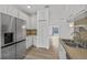 Bright kitchen featuring white cabinets, stainless steel appliances, and wood look countertops at 4112 Aberdeen Ln, Lake Wales, FL 33859
